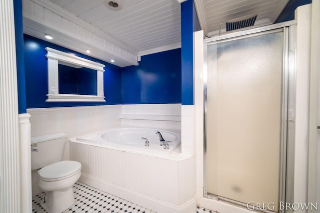 9318 Jefferson Rd, Lakeview, MI 48850 - bathroom with a wainscoted wall, a shower stall, a garden tub, and toilet