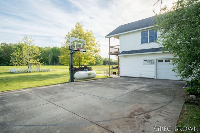 9318 Jefferson Rd, Lakeview, MI 48850 - view of property exterior with driveway, a balcony, a yard, a garage, and a shingled roof