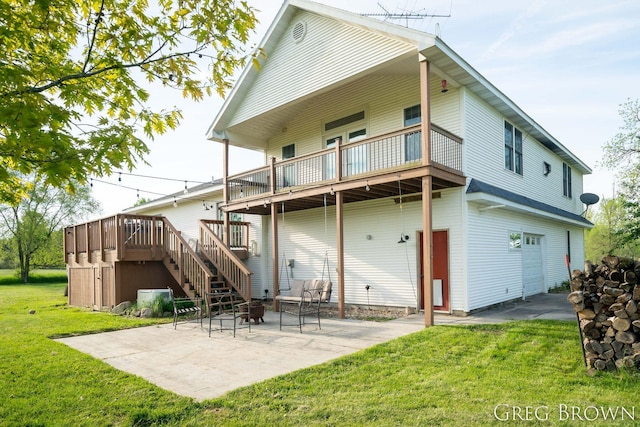 9318 Jefferson Rd, Lakeview, MI 48850 - back of house featuring a lawn, a patio area, a wooden deck, stairway, and an attached garage