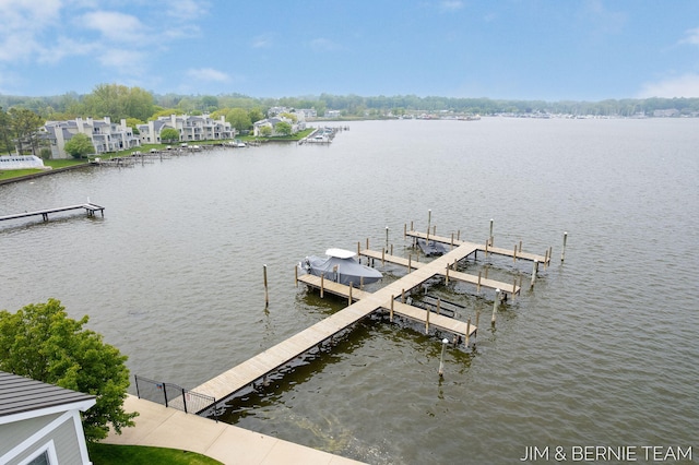 807 Lake St Unit 7, Saugatuck, MI 49453 - dock featuring a water view and boat lift