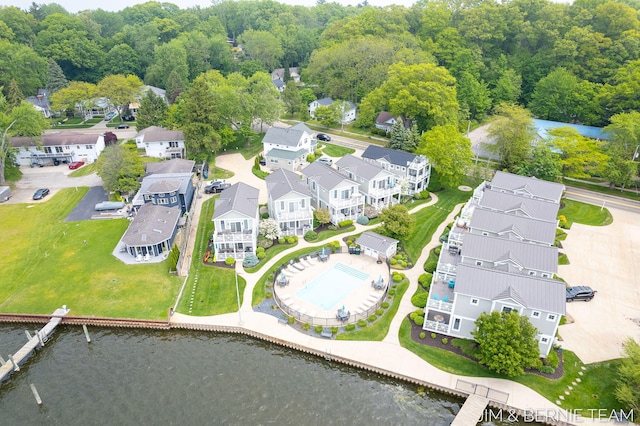 807 Lake St Unit 7, Saugatuck, MI 49453 - aerial view of residential area featuring a pool and a large body of water