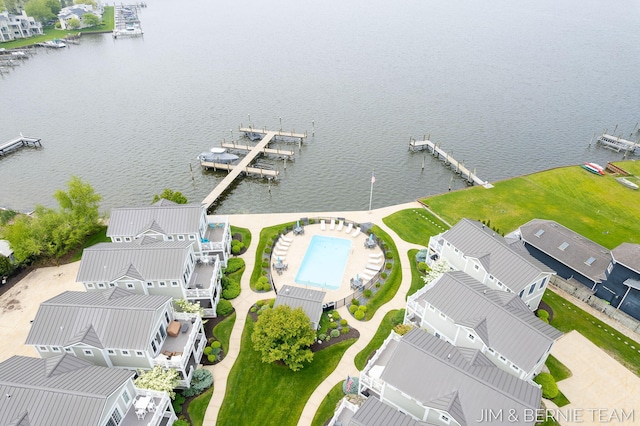 807 Lake St Unit 7, Saugatuck, MI 49453 - aerial perspective of suburban area featuring a large body of water and a pool area