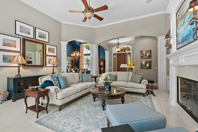 6461 E Bay Ln, Richland, MI 49083 - living room featuring decorative columns, arched walkways, light colored carpet, ceiling fan, and a tile fireplace