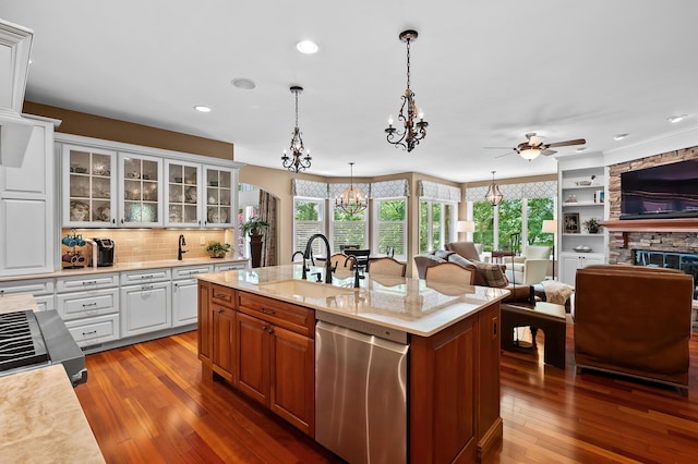 6461 E Bay Ln, Richland, MI 49083 - kitchen with stainless steel dishwasher, open floor plan, dark wood-type flooring, a ceiling fan, and recessed lighting