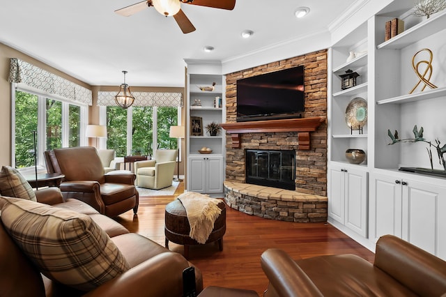 6461 E Bay Ln, Richland, MI 49083 - living room featuring ceiling fan, hardwood / wood-style floors, built in shelves, and crown molding
