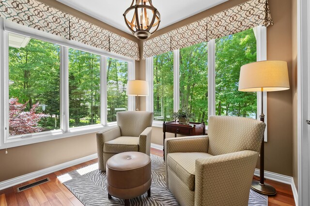 6461 E Bay Ln, Richland, MI 49083 - sunroom with baseboards, plenty of natural light, and wood finished floors