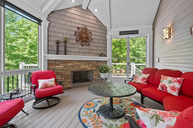 6461 E Bay Ln, Richland, MI 49083 - sunroom featuring wood walls, wood ceiling with exposed beams, hardwood / wood-style floors, high vaulted ceiling, and an outdoor living space with a fireplace