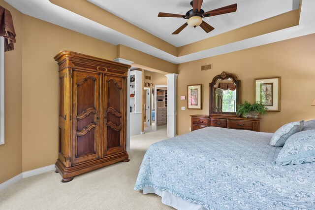 6461 E Bay Ln, Richland, MI 49083 - bedroom featuring light carpet, decorative columns, ceiling fan, and baseboards