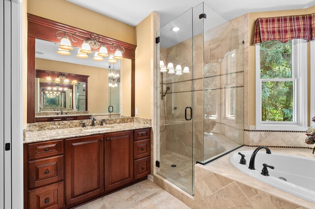 6461 E Bay Ln, Richland, MI 49083 - bathroom featuring a garden tub, vanity, a stall shower, and plenty of natural light