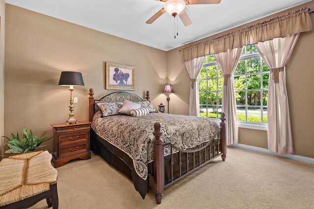 6461 E Bay Ln, Richland, MI 49083 - bedroom featuring light colored carpet, ceiling fan, and baseboards
