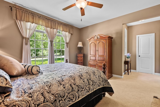 6461 E Bay Ln, Richland, MI 49083 - bedroom featuring light carpet, baseboards, and a ceiling fan