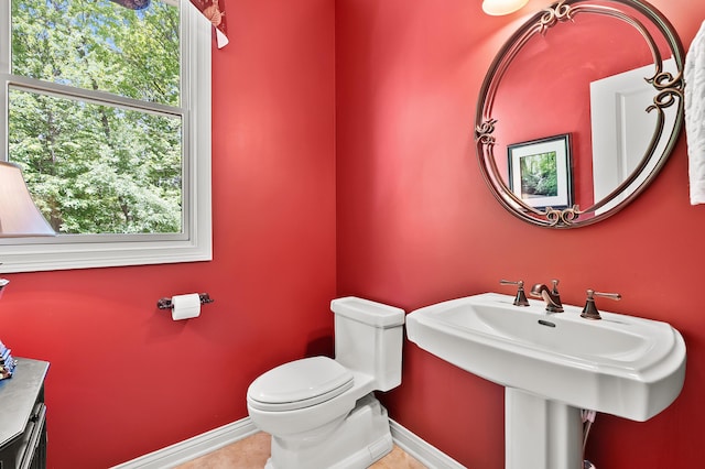 6461 E Bay Ln, Richland, MI 49083 - bathroom featuring baseboards, toilet, plenty of natural light, and tile patterned flooring