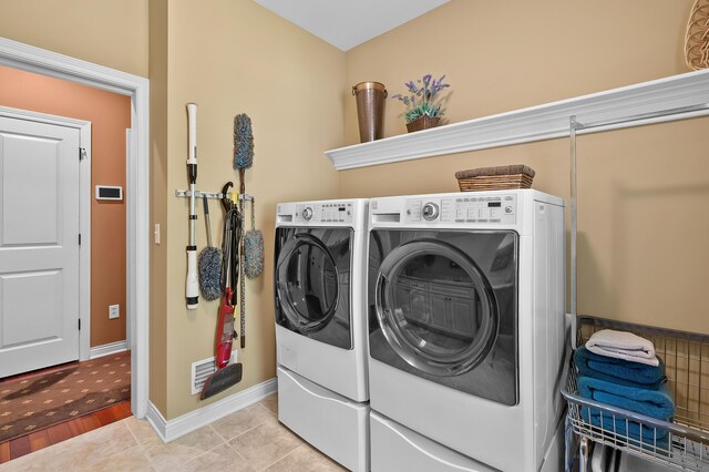 6461 E Bay Ln, Richland, MI 49083 - washroom featuring washing machine and clothes dryer and baseboards
