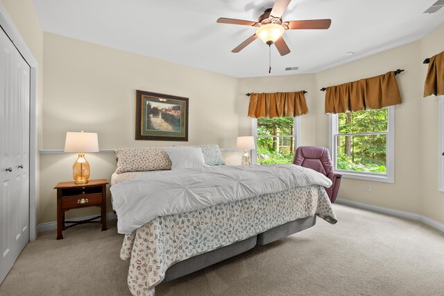 6461 E Bay Ln, Richland, MI 49083 - bedroom featuring carpet, a closet, baseboards, and a ceiling fan