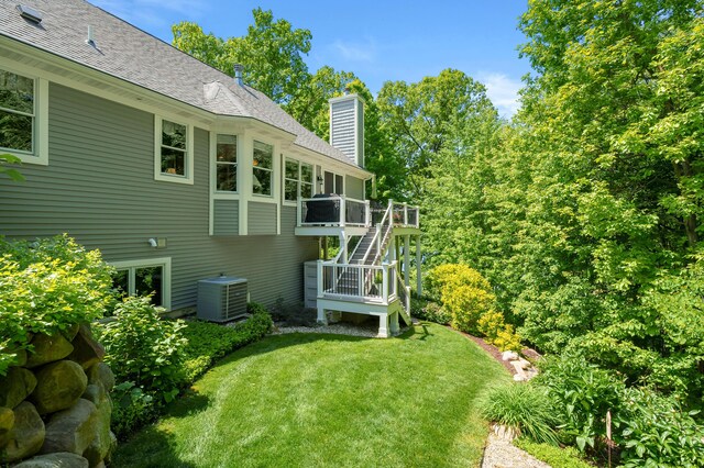 6461 E Bay Ln, Richland, MI 49083 - view of grassy yard with stairs, central AC, and a wooden deck