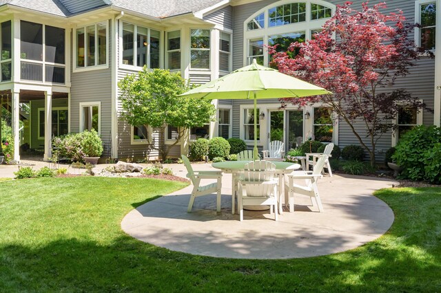 6461 E Bay Ln, Richland, MI 49083 - view of patio with outdoor dining space and a sunroom