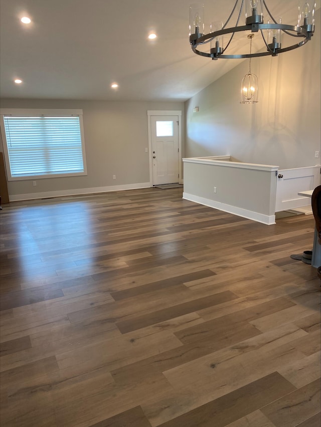 3699 Teton Dr, Hudsonville, MI 49426 - unfurnished living room featuring a chandelier, baseboards, recessed lighting, and wood finished floors