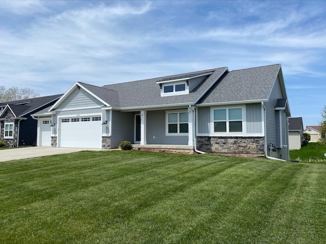 3699 Teton Dr, Hudsonville, MI 49426 - view of front of home featuring stone siding, an attached garage, roof with shingles, and a front lawn
