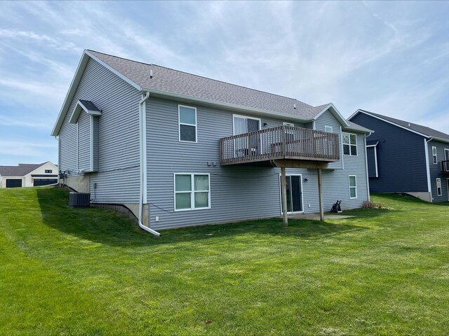 3699 Teton Dr, Hudsonville, MI 49426 - rear view of property featuring central AC, a yard, and a wooden deck
