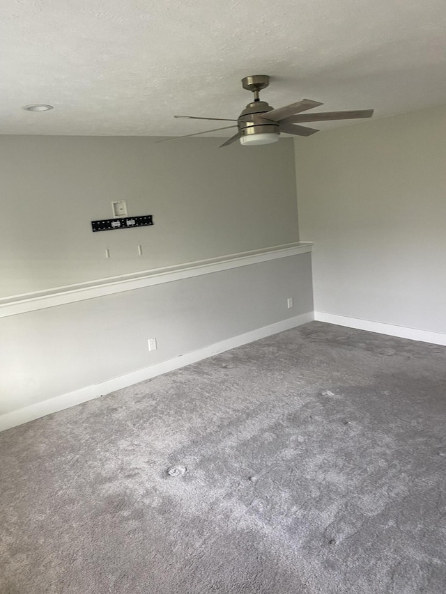 3699 Teton Dr, Hudsonville, MI 49426 - spare room with a ceiling fan, dark colored carpet, baseboards, and a textured ceiling