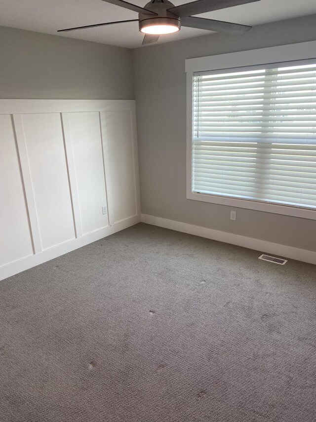 3699 Teton Dr, Hudsonville, MI 49426 - unfurnished bedroom with baseboards, carpet floors, ceiling fan, and a closet