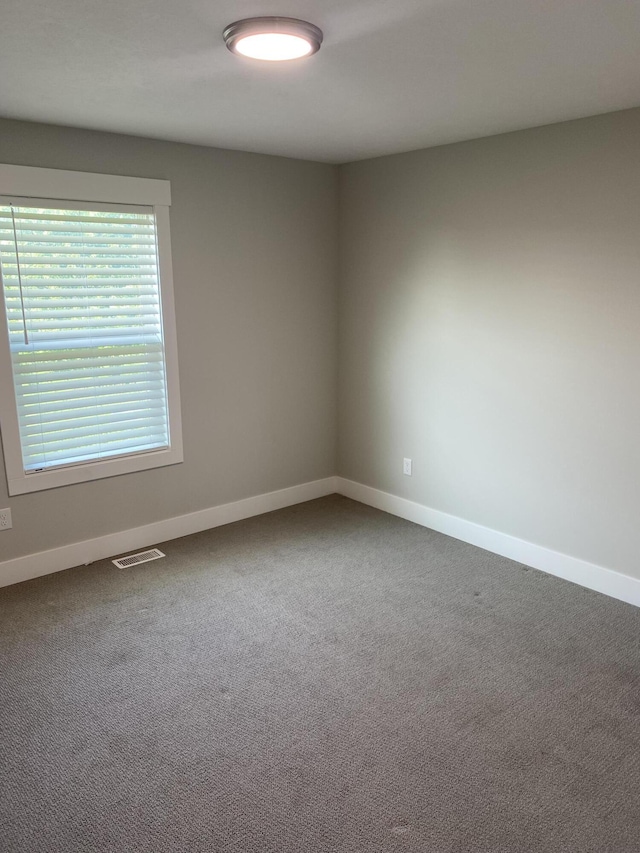 3699 Teton Dr, Hudsonville, MI 49426 - unfurnished room with baseboards and carpet floors