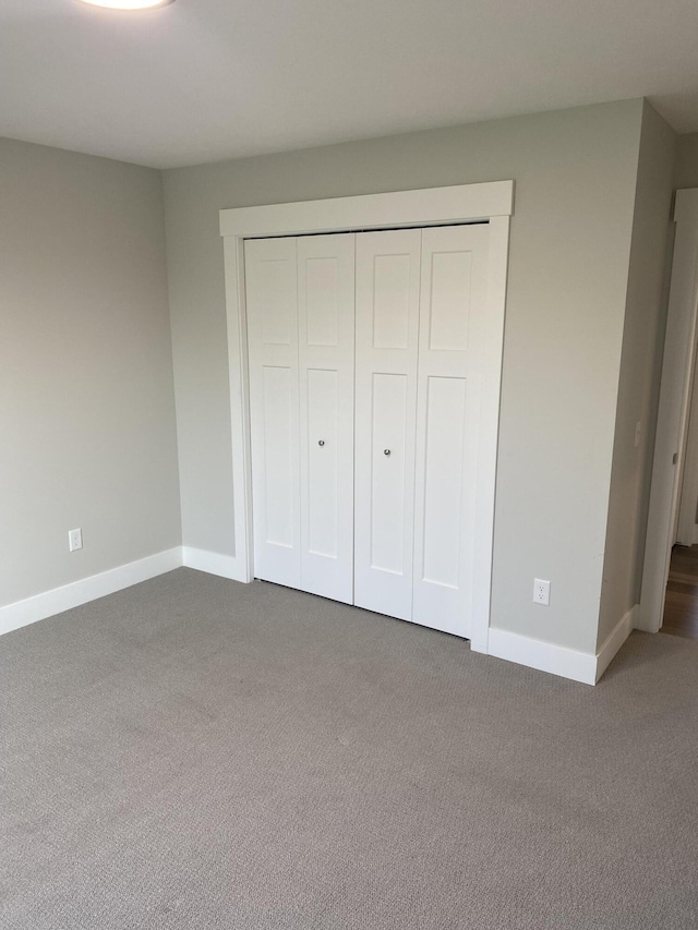 3699 Teton Dr, Hudsonville, MI 49426 - unfurnished bedroom with carpet flooring, baseboards, and a closet