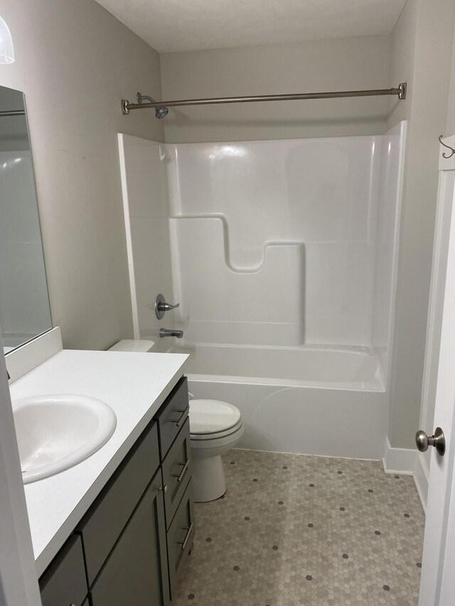3699 Teton Dr, Hudsonville, MI 49426 - bathroom with vanity, toilet, tile patterned floors, and shower / bathtub combination