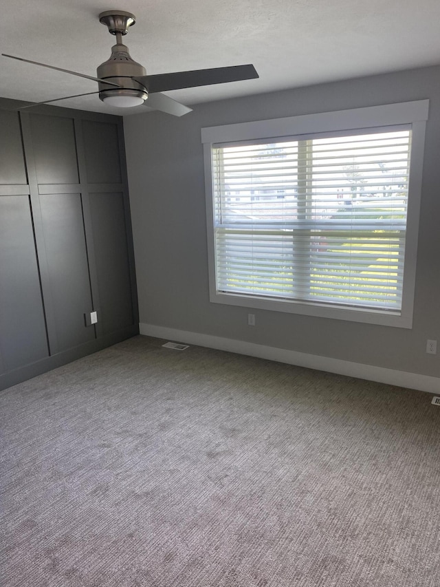 3699 Teton Dr, Hudsonville, MI 49426 - unfurnished bedroom with multiple windows, baseboards, a closet, and carpet floors