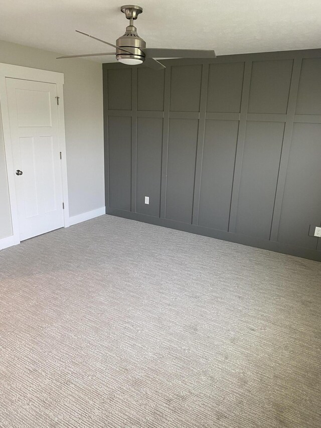 3699 Teton Dr, Hudsonville, MI 49426 - unfurnished bedroom with carpet flooring, baseboards, and ceiling fan