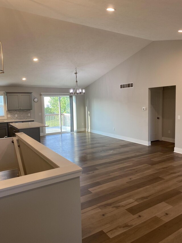 3699 Teton Dr, Hudsonville, MI 49426 - kitchen featuring gray cabinetry, baseboards, a chandelier, dark wood-style flooring, and recessed lighting