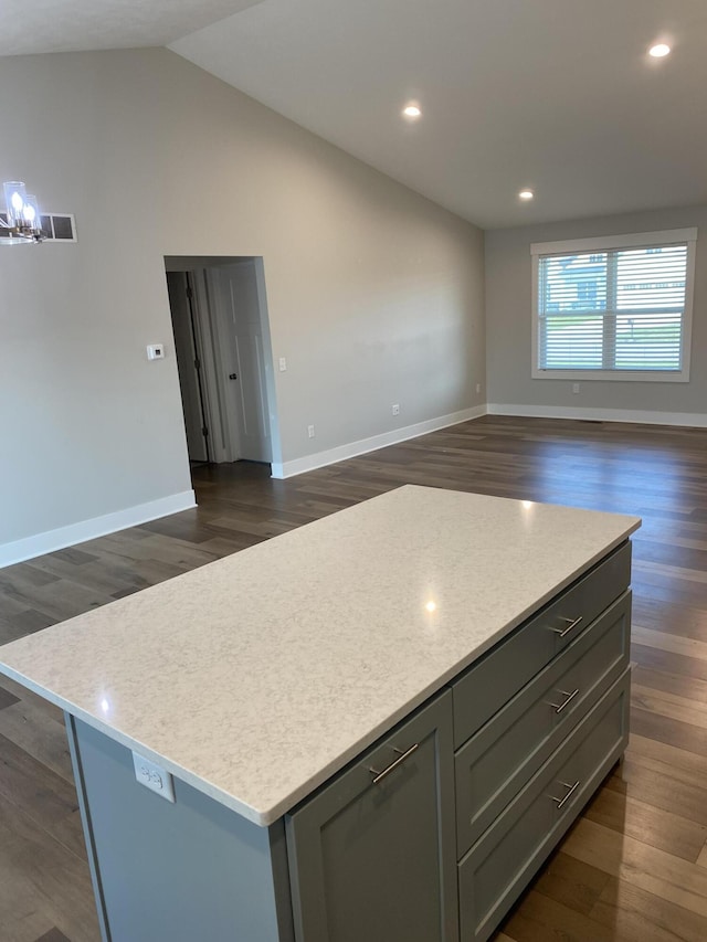 3699 Teton Dr, Hudsonville, MI 49426 - kitchen featuring open floor plan, light countertops, a kitchen island, dark wood finished floors, and vaulted ceiling