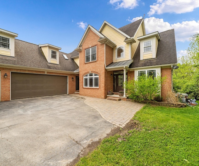 6201 Donovanridge, Dexter, MI 48130 - view of front facade featuring brick siding, asphalt driveway, roof with shingles, and a front lawn