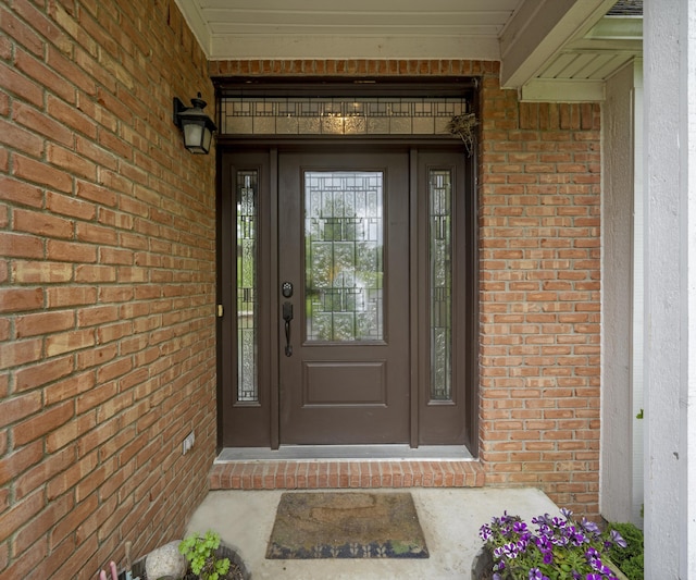 6201 Donovanridge, Dexter, MI 48130 - doorway to property featuring brick siding