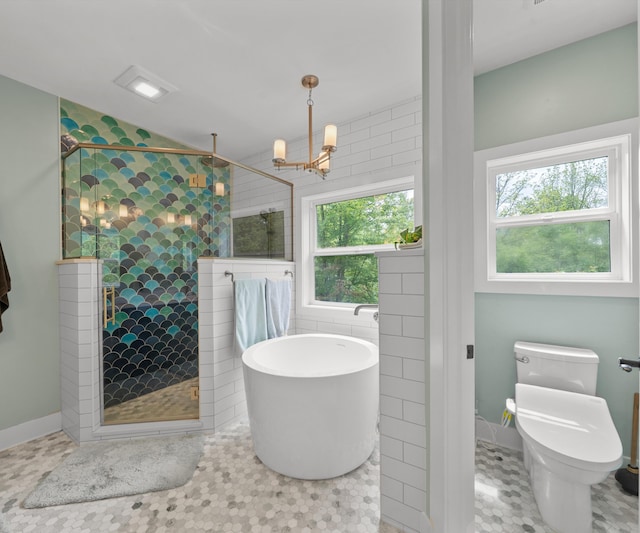 6201 Donovanridge, Dexter, MI 48130 - full bath featuring a soaking tub, a shower stall, a chandelier, toilet, and baseboards