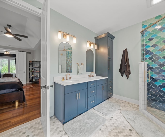 6201 Donovanridge, Dexter, MI 48130 - ensuite bathroom featuring a ceiling fan, double vanity, baseboards, and a shower