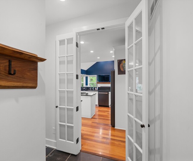 6201 Donovanridge, Dexter, MI 48130 - hall featuring french doors, recessed lighting, wood finished floors, and a sink