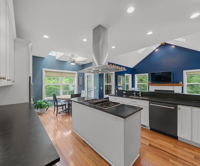 6201 Donovanridge, Dexter, MI 48130 - kitchen with a skylight, stainless steel appliances, island range hood, dark countertops, and a sink