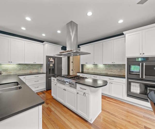 6201 Donovanridge, Dexter, MI 48130 - kitchen featuring stainless steel appliances, island exhaust hood, dark countertops, a sink, and recessed lighting