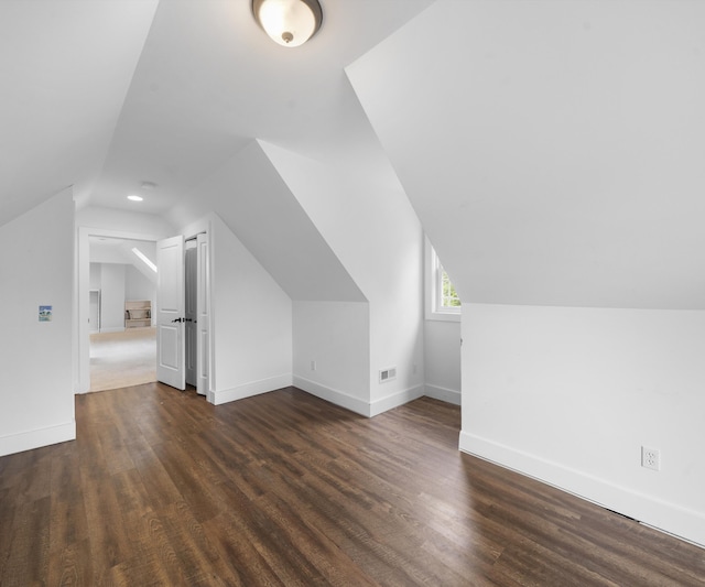 6201 Donovanridge, Dexter, MI 48130 - bonus room featuring vaulted ceiling, dark wood-style flooring, and baseboards