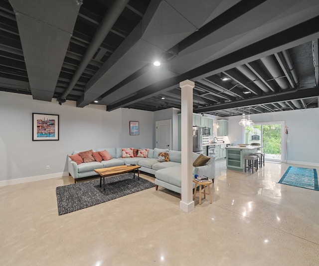 6201 Donovanridge, Dexter, MI 48130 - living room with finished concrete flooring and baseboards