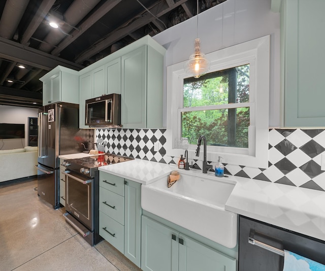6201 Donovanridge, Dexter, MI 48130 - kitchen with appliances with stainless steel finishes, green cabinets, a sink, light countertops, and backsplash