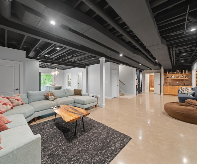 6201 Donovanridge, Dexter, MI 48130 - living area with a bar, finished concrete floors, and stairs