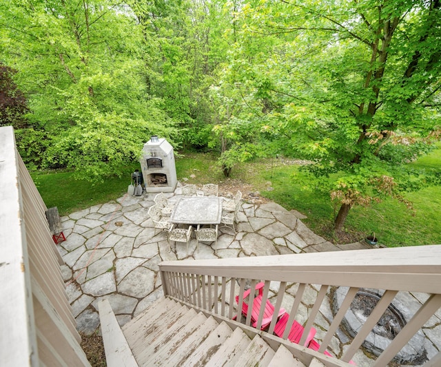 6201 Donovanridge, Dexter, MI 48130 - view of patio / terrace with an outdoor fireplace