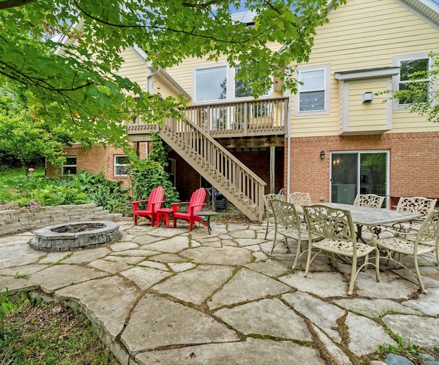 6201 Donovanridge, Dexter, MI 48130 - view of patio / terrace with a fire pit, stairs, a wooden deck, and outdoor dining space