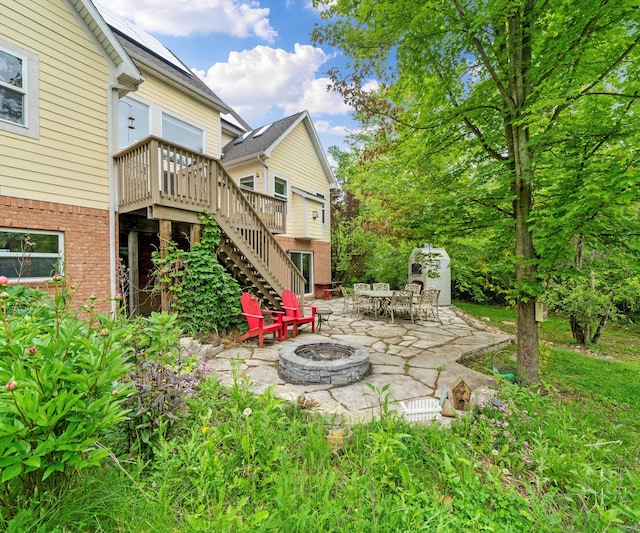 6201 Donovanridge, Dexter, MI 48130 - view of yard featuring an outdoor fire pit, stairs, a deck, and a patio area