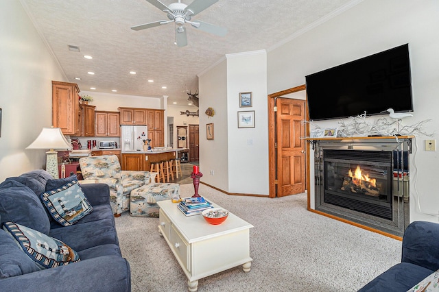 47 Arthur St, Manistee, MI 49660 - living room with a textured ceiling, a glass covered fireplace, a ceiling fan, recessed lighting, and baseboards