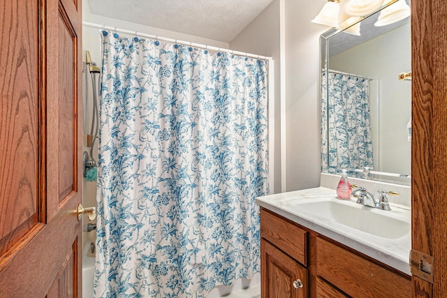 47 Arthur St, Manistee, MI 49660 - bathroom featuring vanity, a textured ceiling, and shower / bath combination with curtain