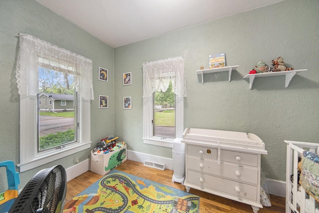 436 Portage St, Grass Lake, MI 49240 - rec room with wood finished floors and baseboards