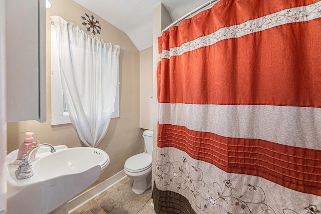 436 Portage St, Grass Lake, MI 49240 - bathroom with toilet, a sink, baseboards, and curtained shower